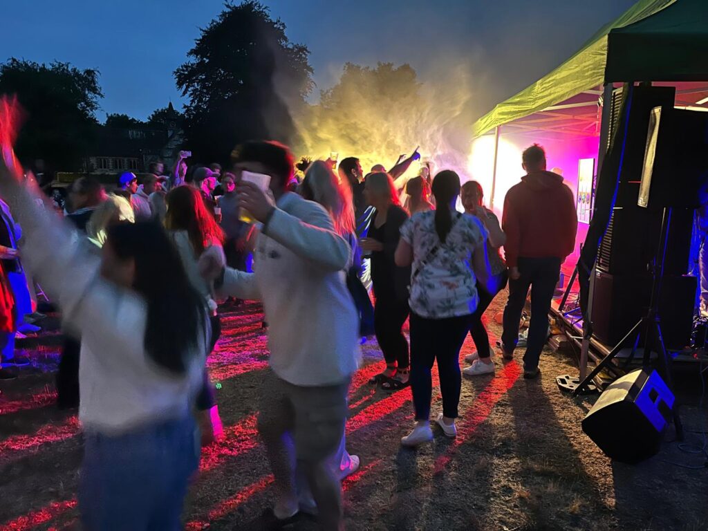 Village Fair attendees dancing to WonderBoy 